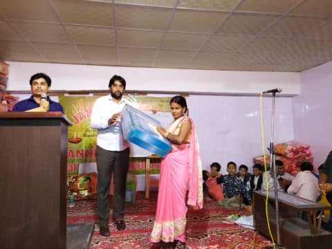 A happy member receiving financial advice from a staff member.